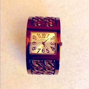 Bronze filigree bracelet watch.